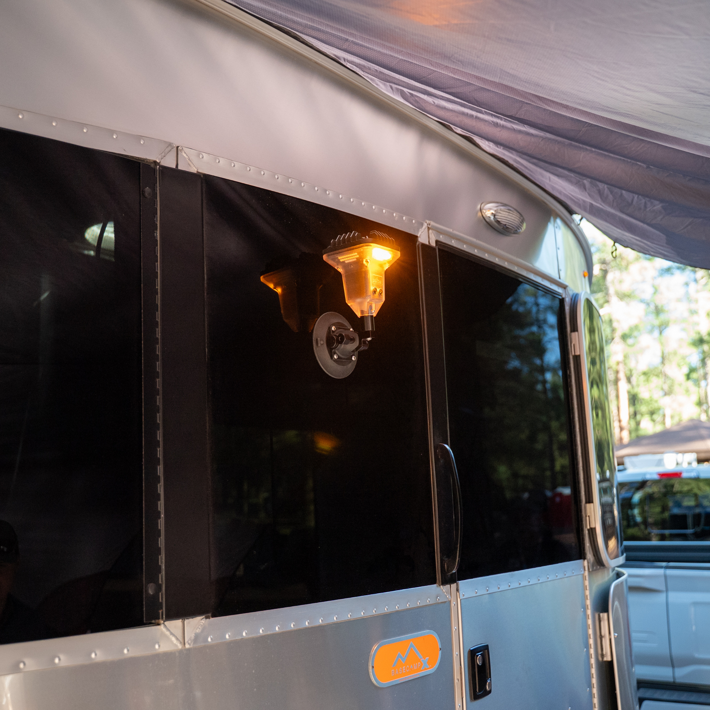 A DEVOS Light Mount by SeaSucker on the side of an RV.