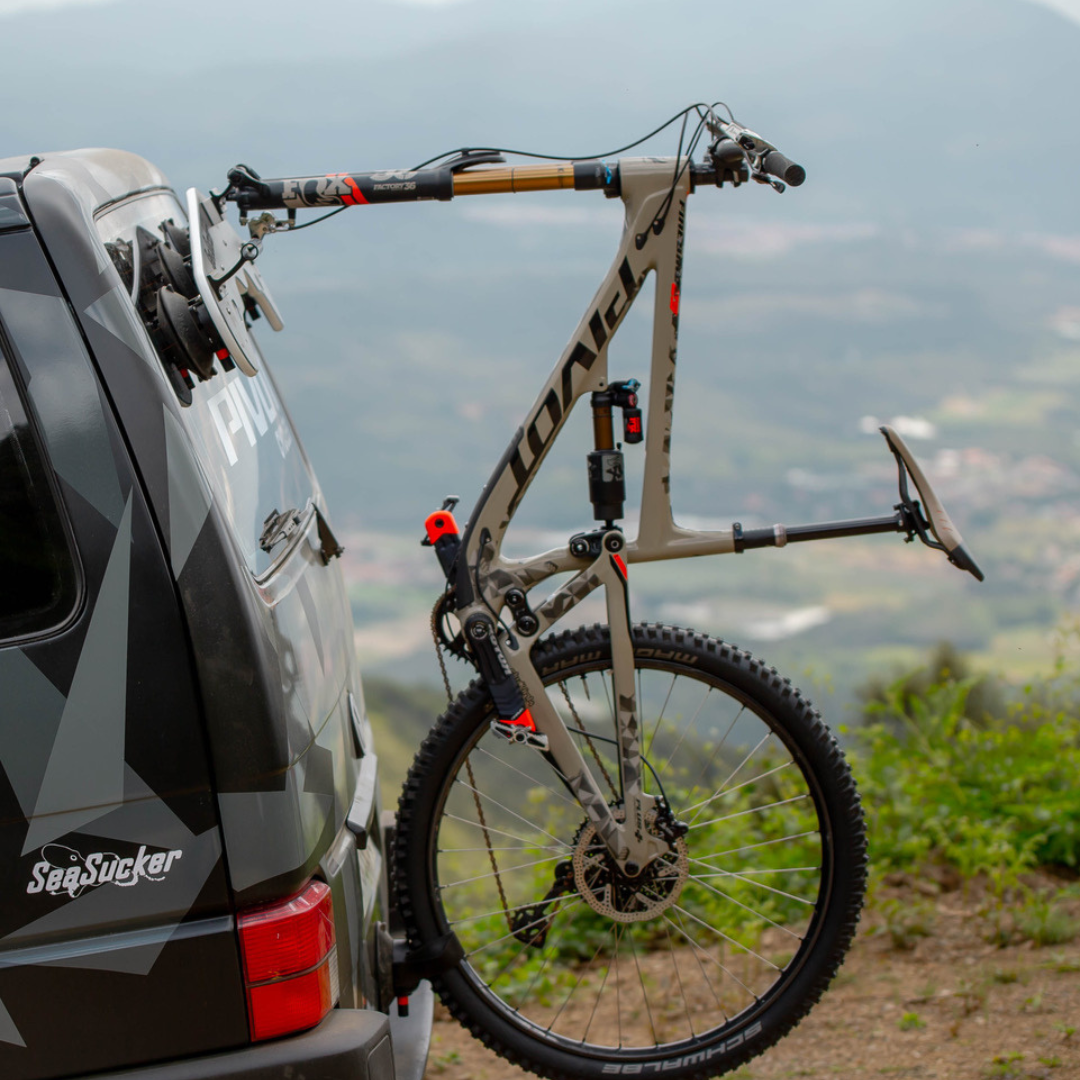 image--all | Bomber - 3 Bikes lifestyle photo with mountain bike mounted to back glass on car