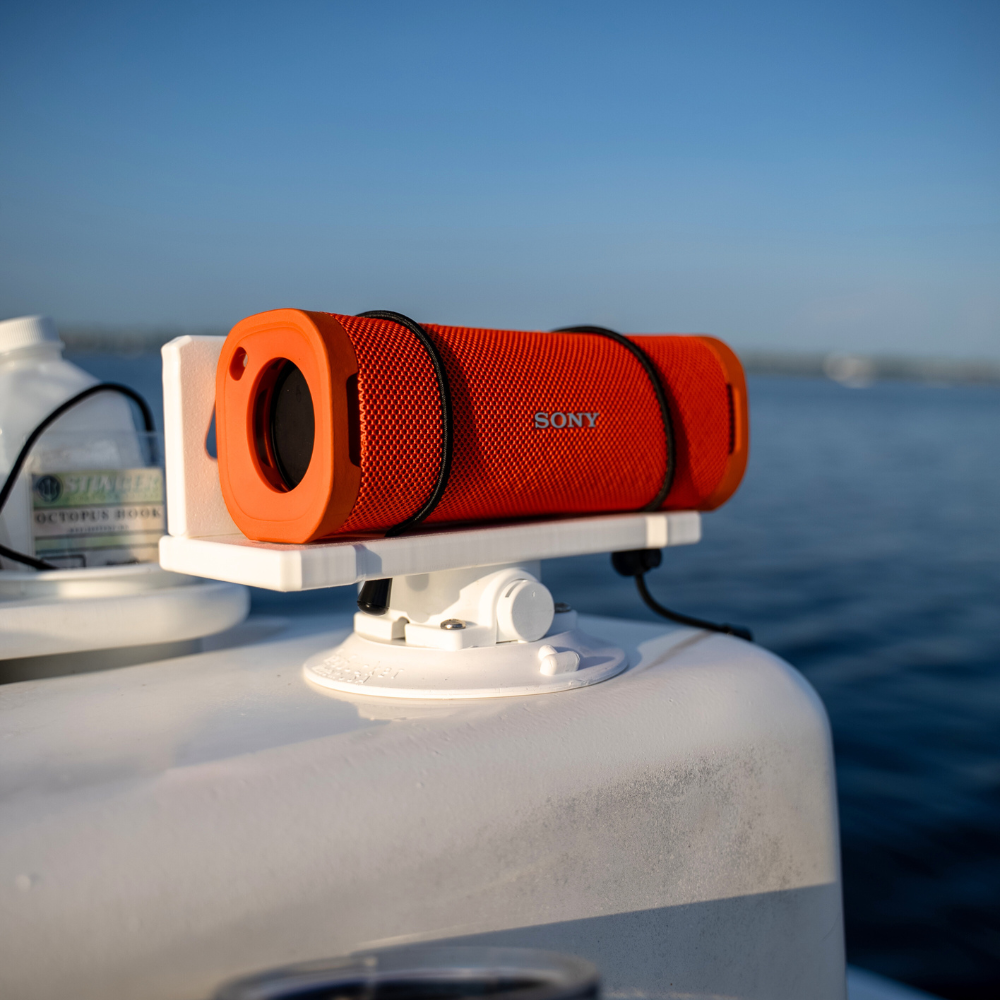 SeaSucker Universal Speaker Mount with Orange Speaker mounted to boat