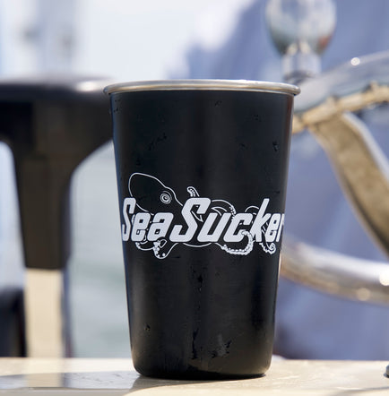 A SeaSucker Pint Glass on a boat deck