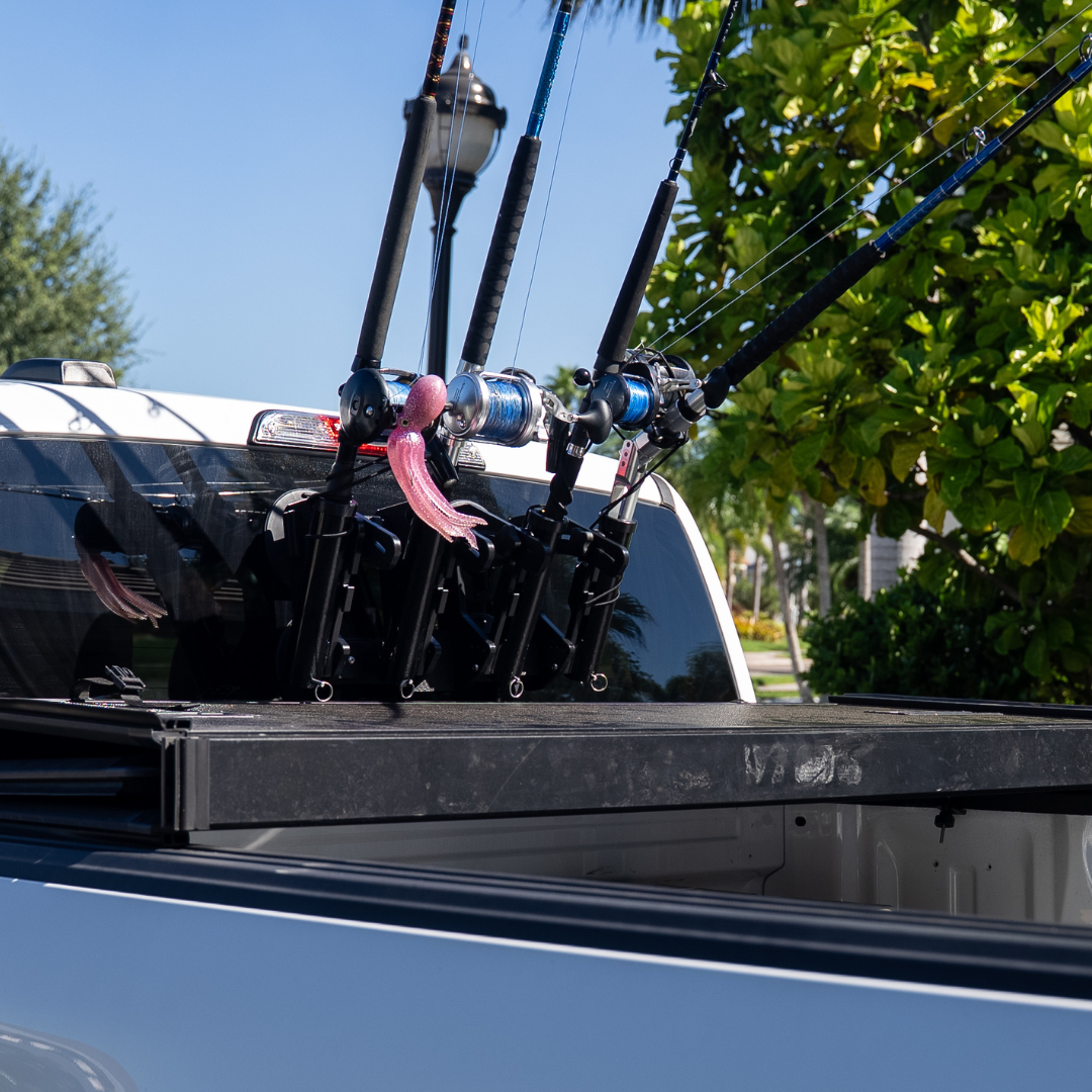 SeaSucker Rocket Launcher mounted to rear glass on truck with fishing rods