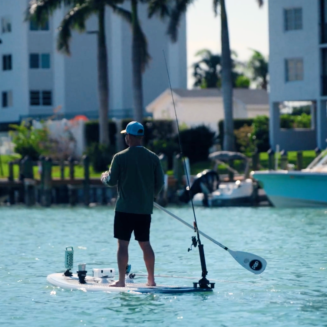 Standing on a SUP using the SeaSucker SUP Rod Holder